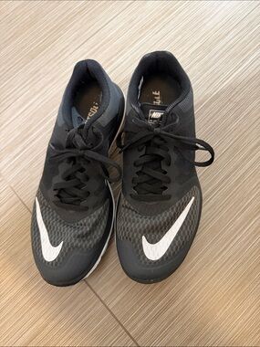 Nike Women's Black Sneakers with White Swoosh
